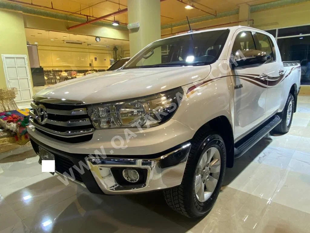 Toyota  Hilux  SR5  2019  Automatic  100,000 Km  4 Cylinder  Four Wheel Drive (4WD)  Pick Up  White  With Warranty