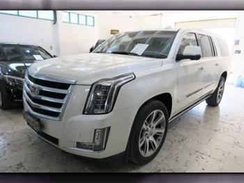 Cadillac  Escalade  2015  Automatic  107,000 Km  8 Cylinder  Four Wheel Drive (4WD)  SUV  White  With Warranty