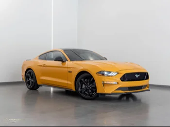 Ford  Mustang  GT Premium  2022  Automatic  9,900 Km  8 Cylinder  Rear Wheel Drive (RWD)  Coupe / Sport  Yellow  With Warranty