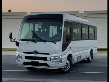 Toyota  Coaster  2022  Manual  0 Km  4 Cylinder  Rear Wheel Drive (RWD)  Van / Bus  White  With Warranty