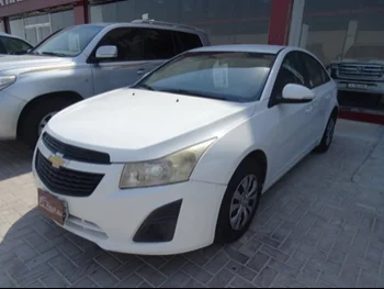 Chevrolet  Cruze  2015  Automatic  64,000 Km  4 Cylinder  Front Wheel Drive (FWD)  Sedan  White  With Warranty