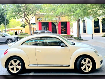 Volkswagen  Beetle  2015  Automatic  110,000 Km  4 Cylinder  Front Wheel Drive (FWD)  Hatchback  Pearl