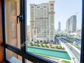 2 Bedrooms  Apartment  For Rent  in Doha -  The Pearl  Semi Furnished